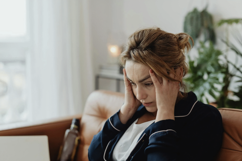 A woman looks frustrated over the thought of school breaks being even longer.